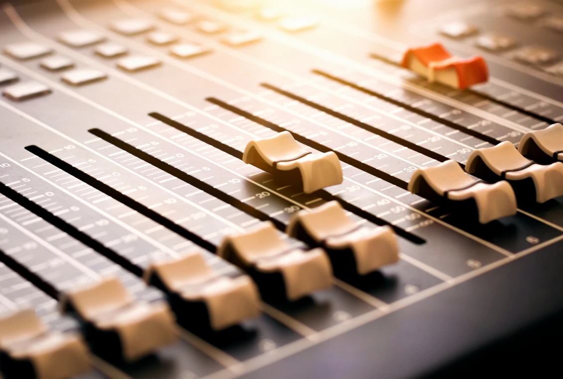 Soundboard with sliders in studio